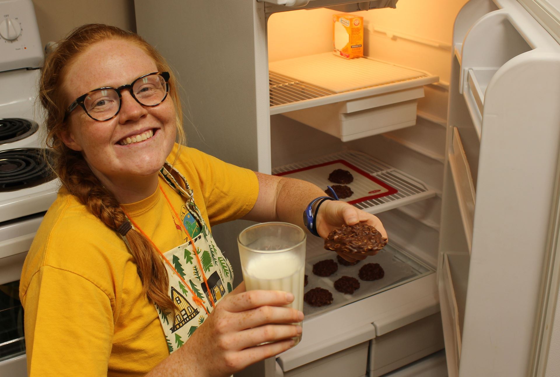 Taylor with milk and cookies from a Camp@Home episode